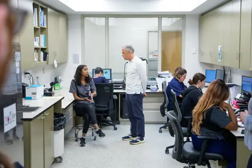 Mark Carney meets with OHS vet tech at work station